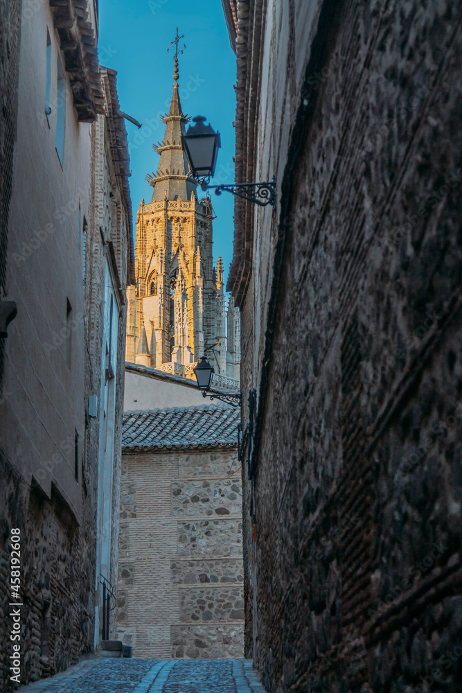 monumental streets of toledo, spain with the cathedral in the background