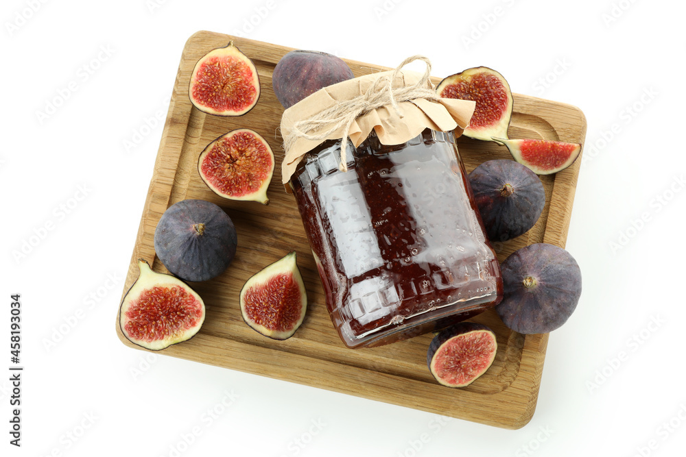 Board with fig jam and ingredients isolated on white background