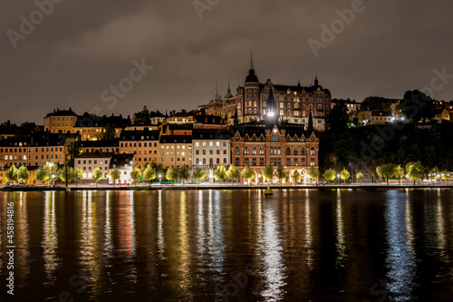 Beautiful evening cityscape view with water reflections. Old buildings on Sodermalm in Stockholm Sweden. © Pebo