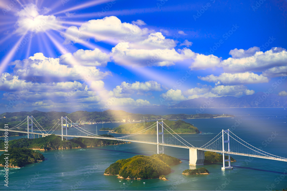 Obraz premium しまなみ海道の来島海峡大橋に差し込む太陽光線