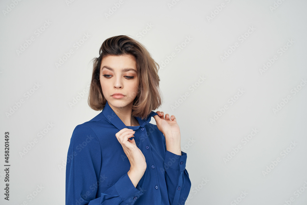 woman in blue shirt fashion elegant style light background woman in blue shirt fashion elegant style light background