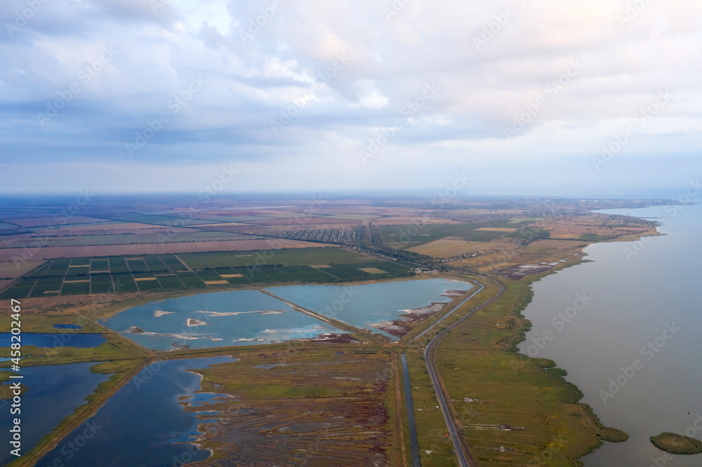 Delta of the Dniester. Agricultural land, places for breeding valuable fish species. Top view, aerial view, drone, quadcopter. Early autumn dawn.