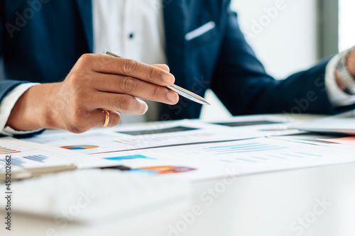 businessman checking financial report in his office