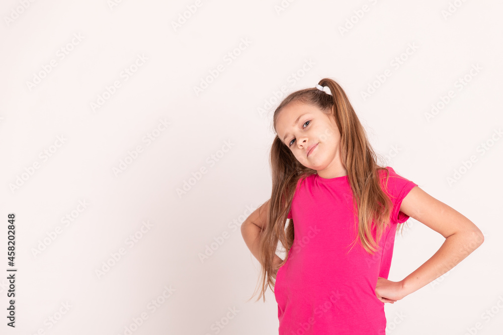 portrait of a beautiful happy girl with tails in a pink T-shirt portrait of a beautiful happy girl with tails in a pink T-shirt