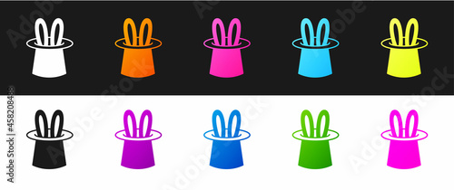 Set Magician hat and rabbit ears icon isolated on black and white background. Magic trick. Mystery entertainment concept. Vector
