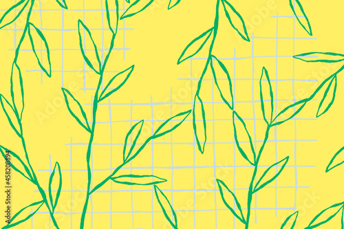 Fototapeta Naklejka Na Ścianę i Meble -  Green leaf pattern vector on yellow grid background
