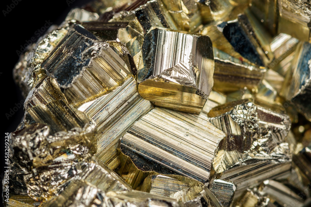 Macro mineral stone Pyrite on a black background Macro mineral stone Pyrite on a black background