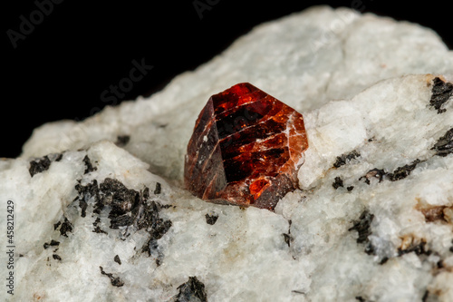 Macro Zircon mineral stone on a black background