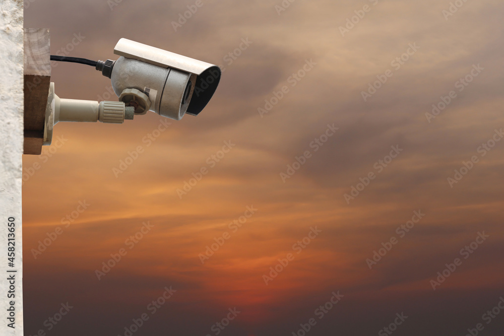 CCTV camera system on twilight sky background.