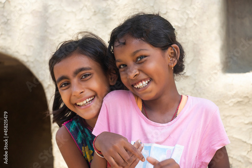 Canvas Print Portrait of two rural girls embracing