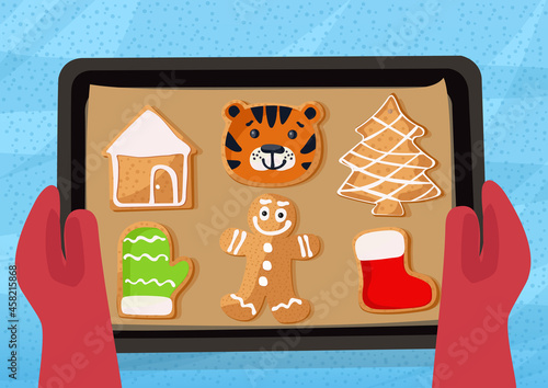 Person holding gingerbread man cookie, Christmas holiday advent. Atmospheric family time. Christmas tradition.

