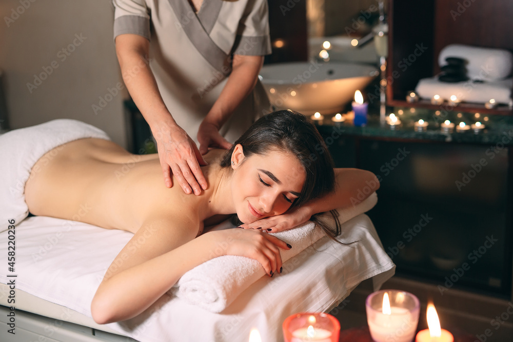 Spa, massage. Young dark-haired beautiful girl doing massage. Spa, massage. Young dark-haired beautiful girl doing massage.