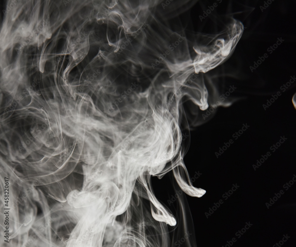 clouds of white smoke on a black background clouds of white smoke on a black background