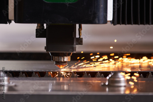 CNC Laser cutting of metal, modern industrial technology. photo