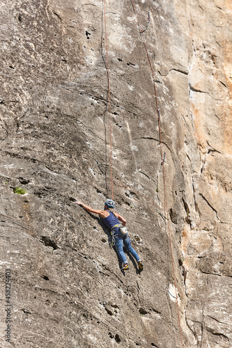 Climber on a granite wall. Extreme sport. Outdoor activity