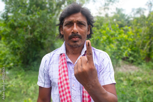 Photography Portrait of Rural man with voters mark on finger