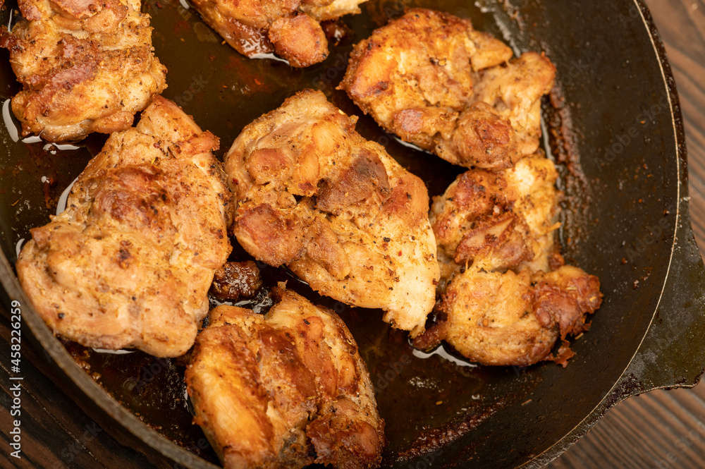 Fried pieces of meat in a frying pan, close-up, selective focus. Fried pieces of meat in a frying pan, close-up, selective focus.