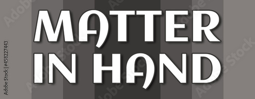 Matter In Hand - text written on grey striped background