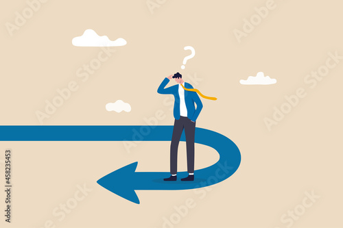 Business turning point, break event or change direction, reverse back, interest rate or financial trend change concept, frustrated businessman investor looking at his reverse direction pathway. photo