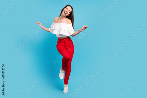 Fototapeta Naklejka Na Ścianę i Meble -  Full length photo of positive cheerful happy nice woman dance smile enjoy isolated on blue color background