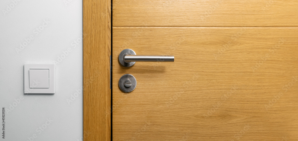 brown wooden door with metal handle. copy space brown wooden door with metal handle. copy space