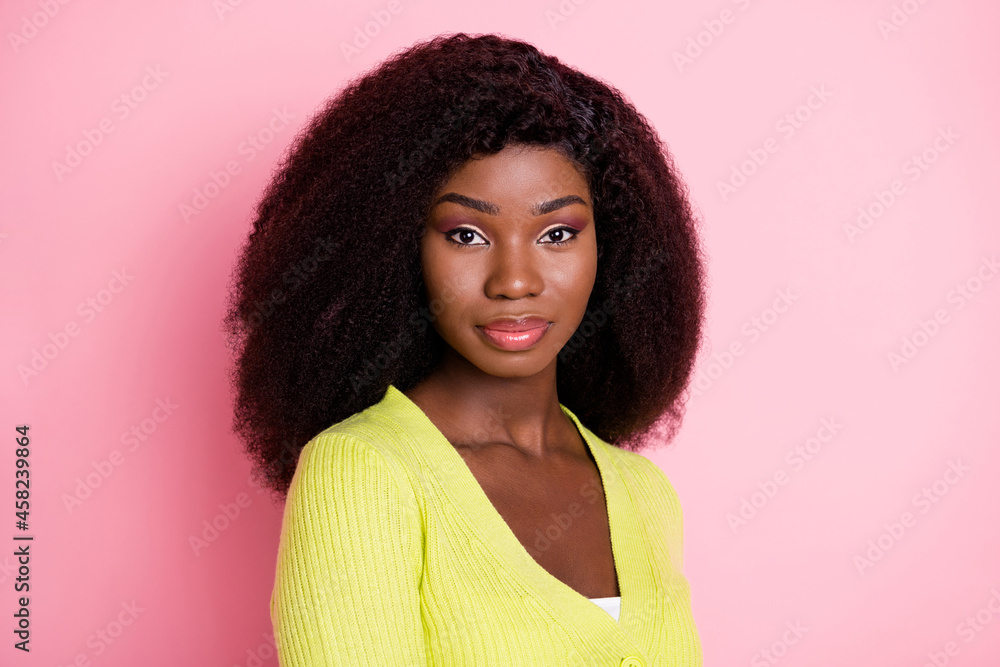 Profile portrait of half turned dark skin person look camera wear green outfit isolated on pink color background Profile portrait of half turned dark skin person look camera wear green outfit isolated on pink color background