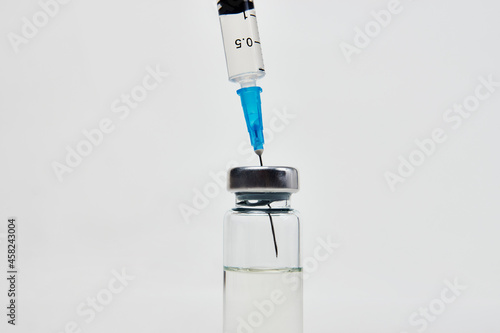 Medical vaccination concept with syringe and medical ampoules