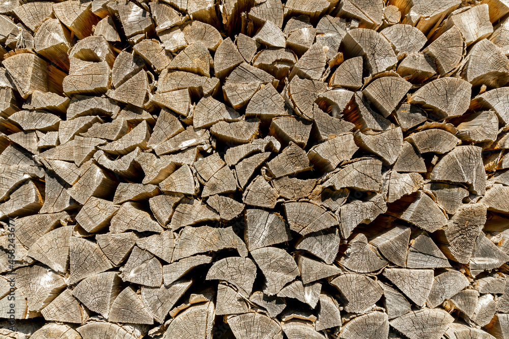 stacked acacia firewood of yellow gray color stacked acacia firewood of yellow gray color