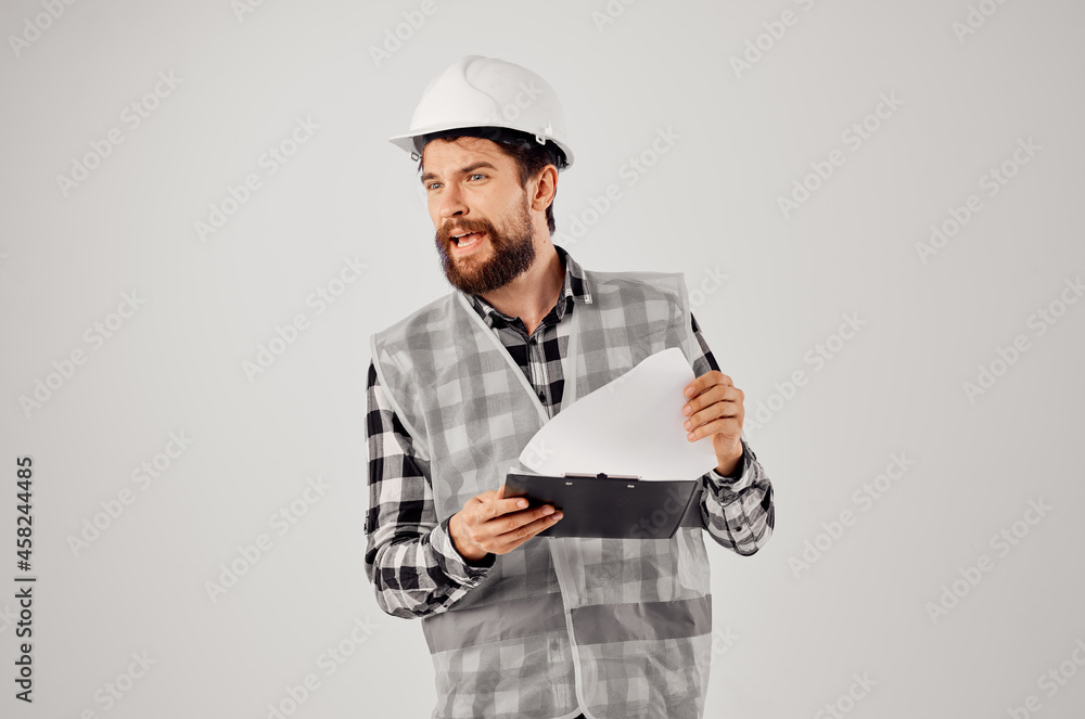 engineer in a white helmet blueprints Professional isolated background engineer in a white helmet blueprints Professional isolated background