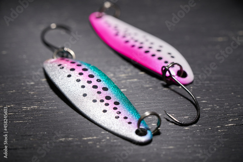 Two fishing lures on a dark table. Preparation for fishing.