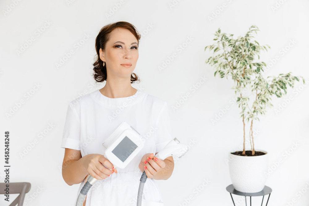 beautiful caucasian girl. The handle of the massage device. body and face massage. beauty salon. Manipulator for lpg massage on the hands of a cosmetologist. beautiful caucasian girl. The handle of the massage device. body and face massage. beauty salon. Manipulator for lpg massage on the hands of a cosmetologist.