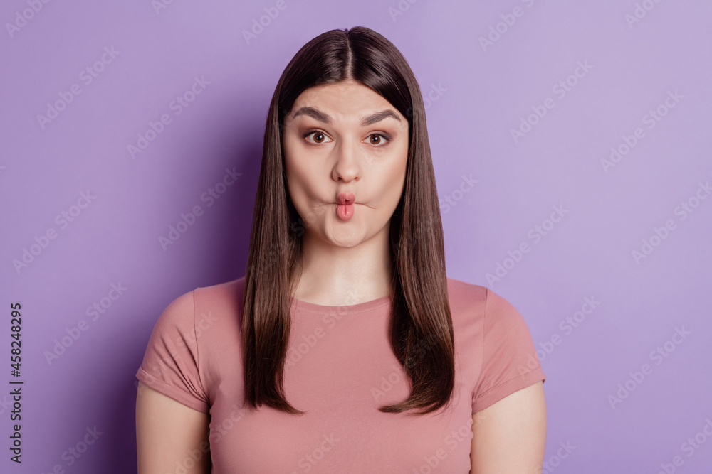 Closeup photo of pretty funny crazy fgirl fooling grimace lipa isolated over violet color background Closeup photo of pretty funny crazy fgirl fooling grimace lipa isolated over violet color background