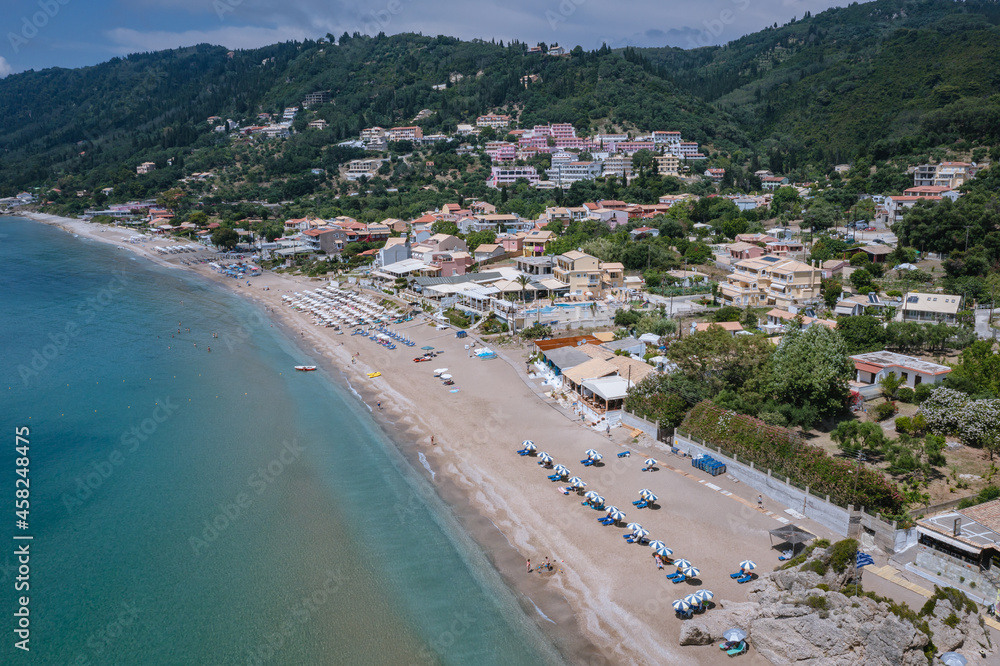 Aerial drone view of beach in Agios Gordios resort village on Corfu Island, Greece