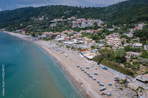 Aerial drone view of beach in Agios Gordios resort village on Corfu Island, Greece