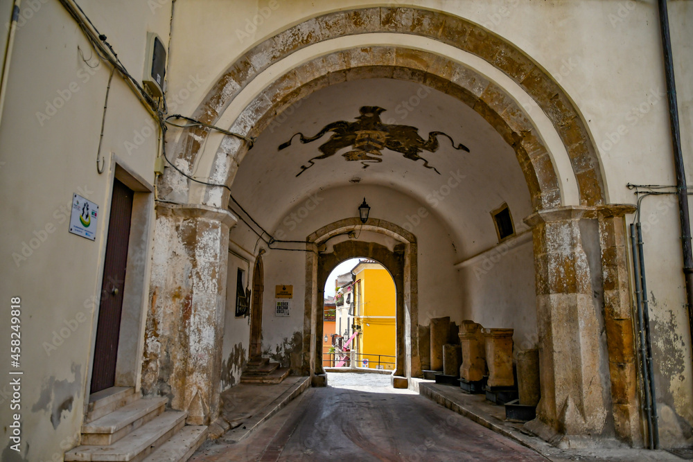 Entrance arch in a medieval castle, now the town hall of Lavello, old town in basilicata region, Italy.