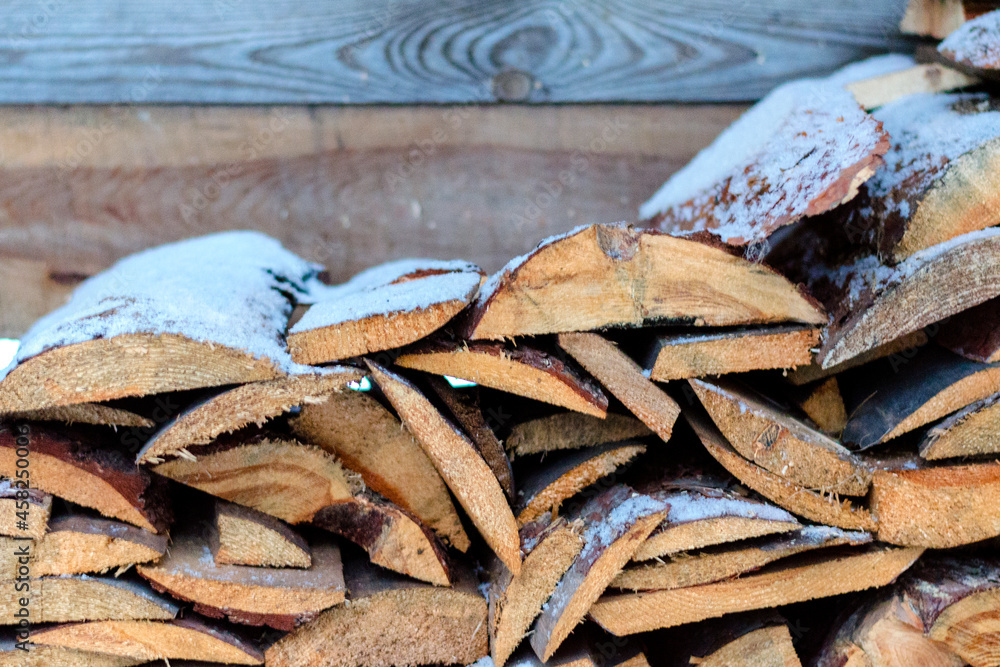 Stacked old boards under the snow. Stacked old boards under the snow.