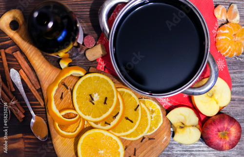 Ingredients for mulled wine. Oranges, wine and spices for making a hot drink