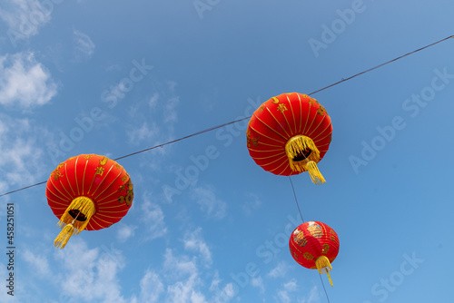 Look up at the red lanterns under the blue sky