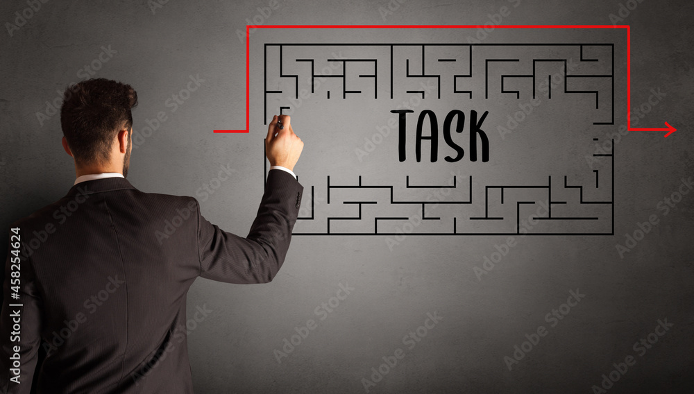 businessman drawing maze concept businessman drawing maze concept