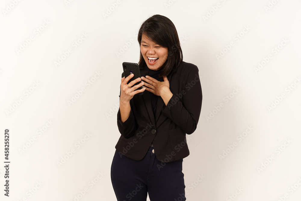 Beautiful Asian Woman Wearing black suit Happy while looking or using smartphone Isolated on white background