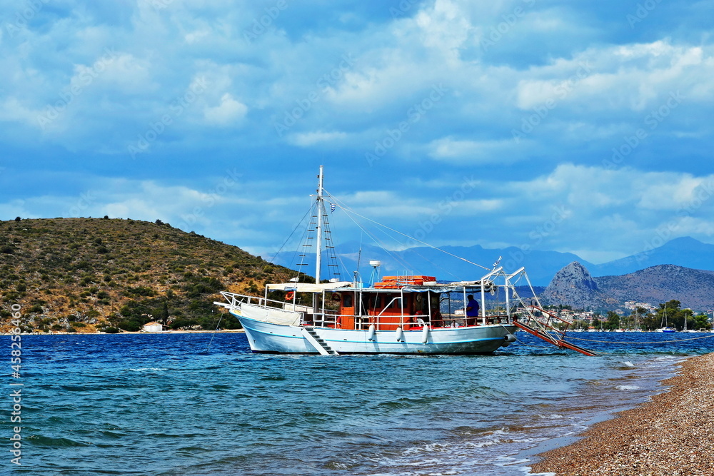 Greece-view of the boat by the coast near Vivari and Kondyli beach