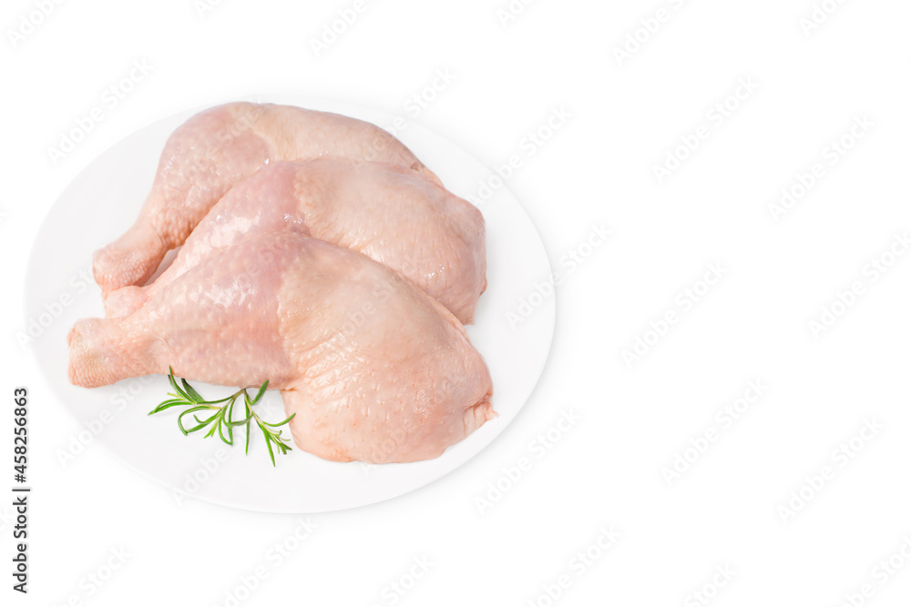 Three raw whole chicken legs on a white plate on a white isolated background. Fresh chicken legs. Three raw whole chicken legs on a white plate on a white isolated background. Fresh chicken legs.