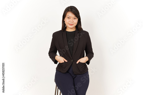 Beautiful Asian Woman Wearing black suit sit and looking at camera Isolated on white background © Sino Images Studio
