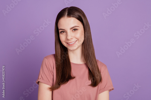 Photo of adorable girl isolated on purple background