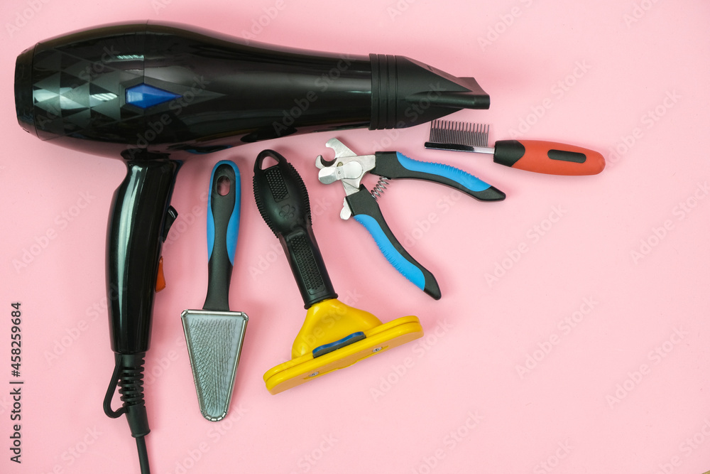 pet care and grooming tools on a pink background. pet care and grooming tools on a pink background.