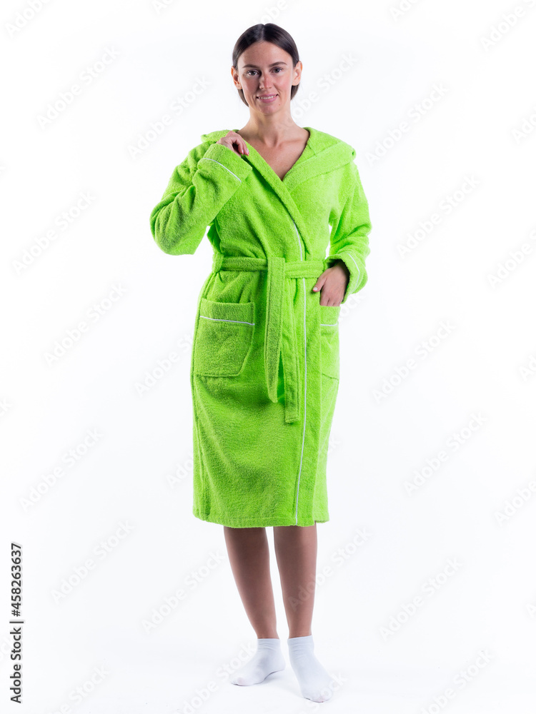 Fototapeta premium woman in a Bathrobe on an isolated white background with a smile on her face.