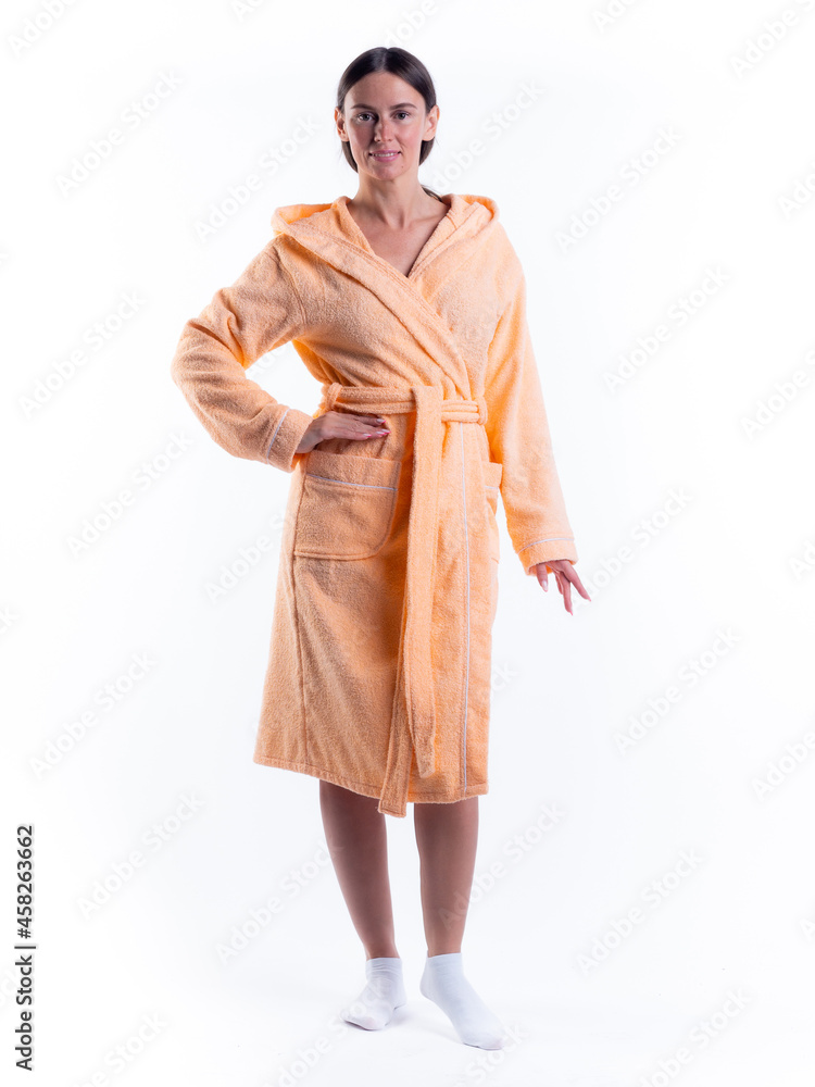 woman in a Bathrobe on an isolated white background with a smile on her face. woman in a Bathrobe on an isolated white background with a smile on her face.