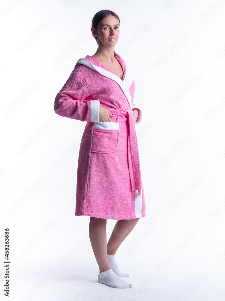 woman in a Bathrobe on an isolated white background with a smile on her face. woman in a Bathrobe on an isolated white background with a smile on her face.