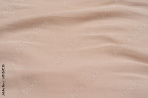 Beautiful smooth elegant wavy beige light brown satin