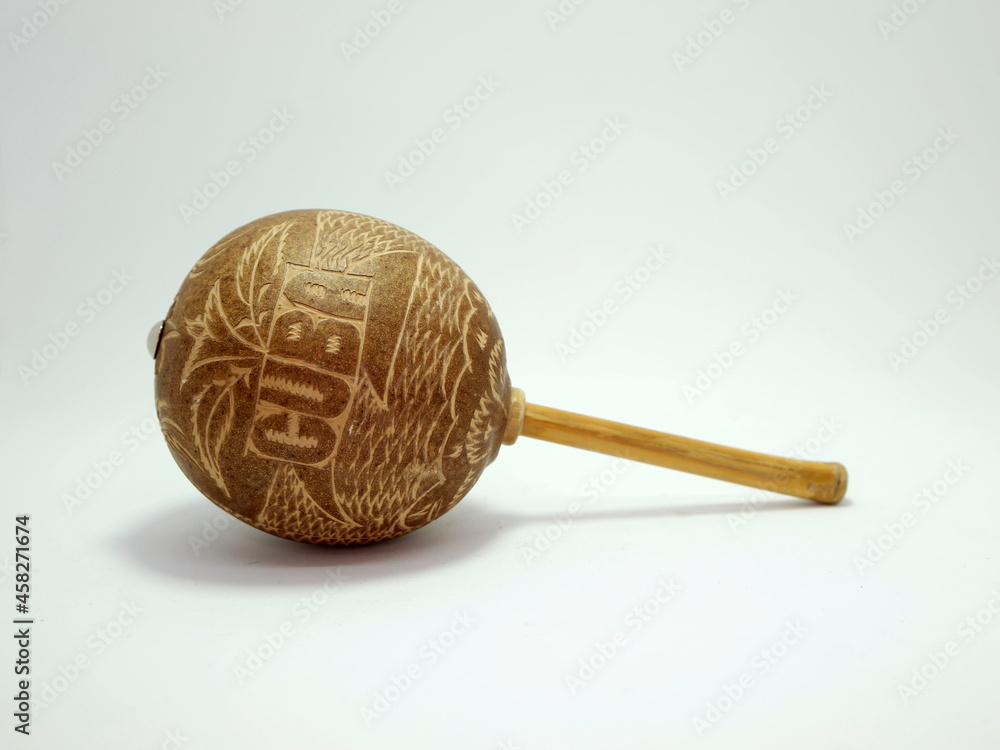 Maraca. Percussion musical instrument. Music. Carved wooden and cane maracas. Rattles Travel memories. Souvenirs from Cuba. Isolated white. Maraca. Percussion musical instrument. Music. Carved wooden and cane maracas. Rattles Travel memories. Souvenirs from Cuba. Isolated white.